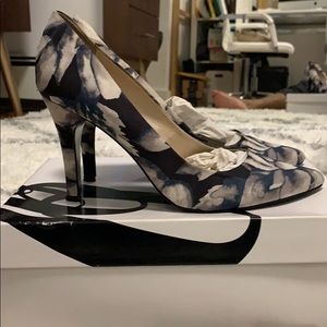 Navy blue and white floral pumps